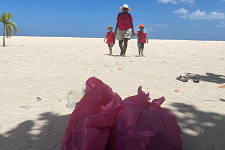 Adopt a Coastline volunteers smiling together after another successful cleanup