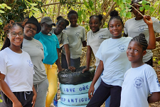 Adopt a Coastline volunteers smiling together after a successful coastal preservation event