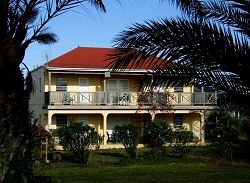 1st green villa apartments antigua - a view of the front exterior with scenery of the villa rental